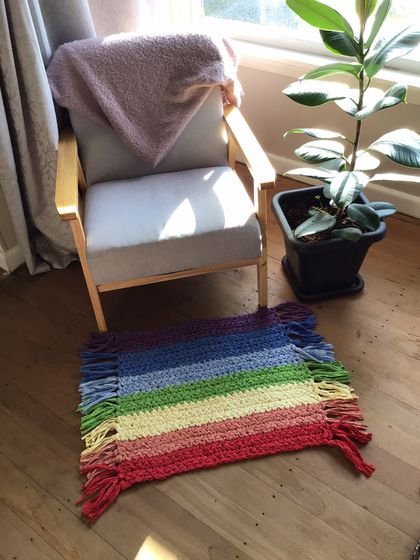 Rainbow rug with tassels